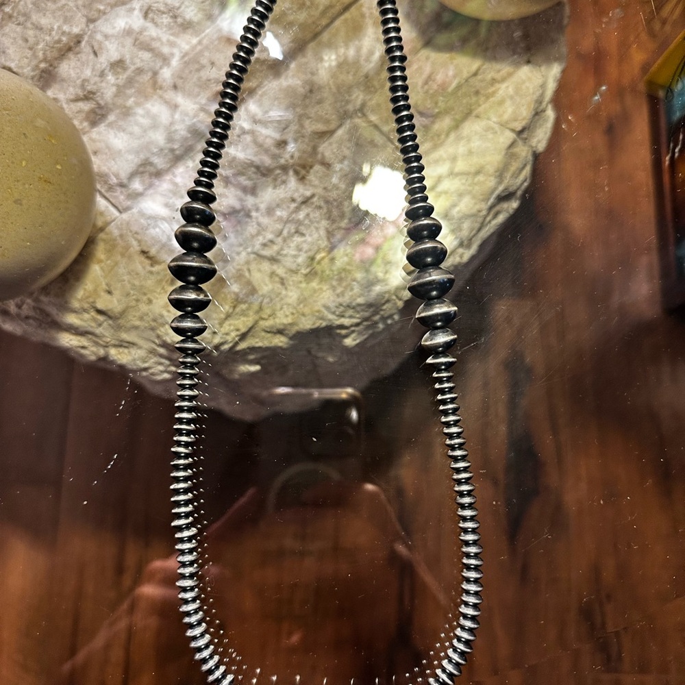 Native strung silver saucer pearl necklace